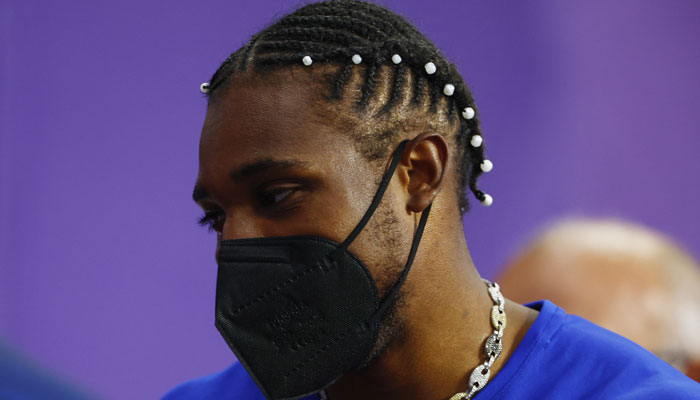 Bronze medallist Noah Lyles of United States is pictured in a protective face mask after receiving medical attention after the race on August 8. — Reuters