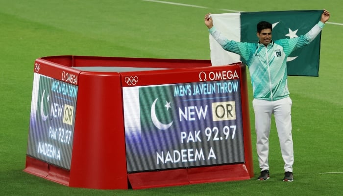 Gold medallist Pakistani athlete Arshad Nadeem poses after setting a new Olympic record. —Reuters