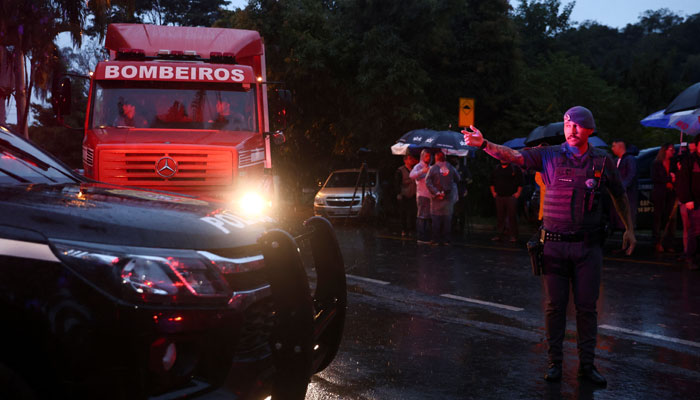 Authorities arrive at the site where a turboprop plane crashed killing all passengers and crew on board, in Vinhedo, Brazil August 9, 2024. —Reuters