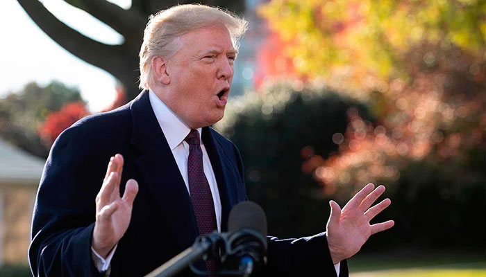 US President Donald Trump speaks to the press as he departs the White House in Washington, DC, on November 20, 2018. — AFP