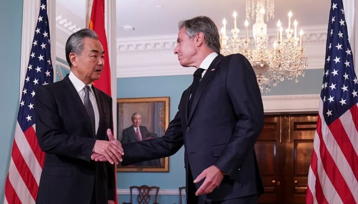 US Secretary of State Antony Blinken (right) shakes hands with Chinese Foreign Minister Wang Yi as they meet at the State Department in Washington, US, on October 26, 2023. —Reuters