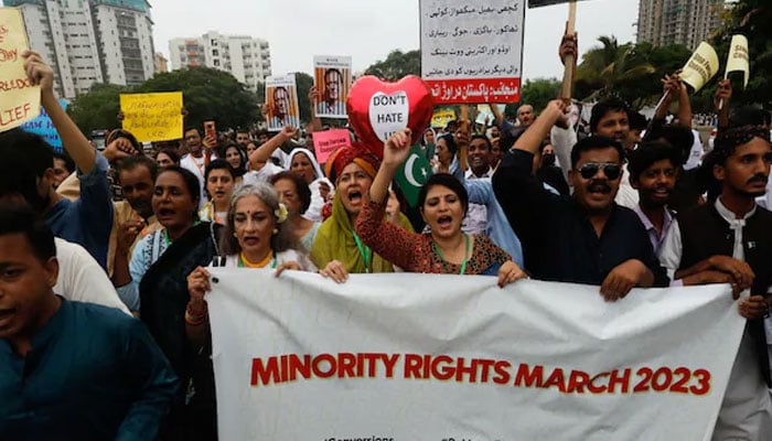 Image shows human rights activists and civil society members participating in minority right march on August 11, 2023. — Reuters