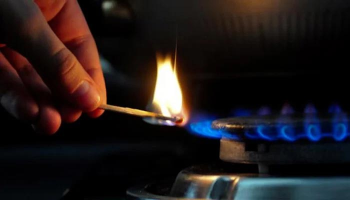 A representational image of a person lighting a stove. — AFP/File