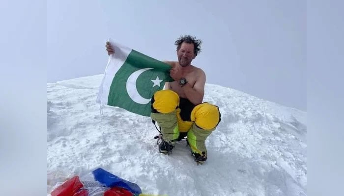 A representational image showing mountaineer Murad Sadpara posing with the national flag in this image released on August 11, 2024. — X/@sadiqsidiqiGB_