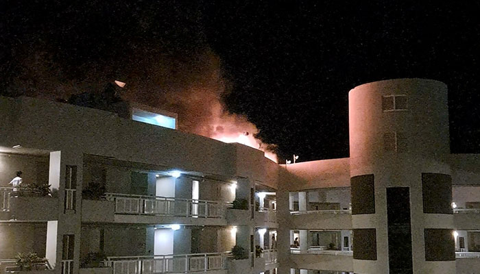 A fire burns at the Double Tree Hotel after a helicopter crashed into the roof in Cairns, Australia, August 12, 2024, in this still image taken from social media video. — Reuters