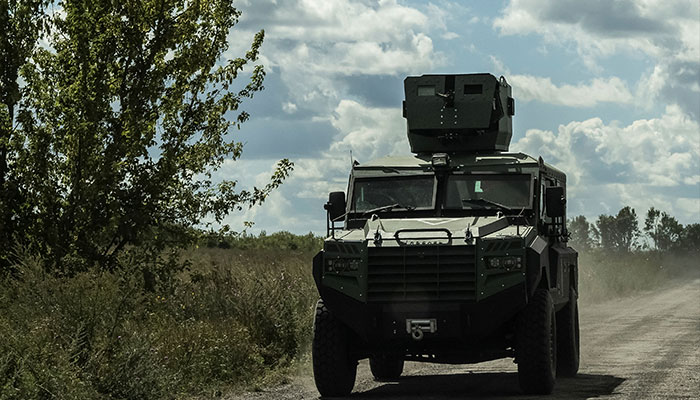 Ukranian servicemen ride a military vehicle near the Russian border in Sumy region. amid Russias attack on Ukraine, near the Russian border in Sumy region, Ukraine on August 12, 2024. — Reuters