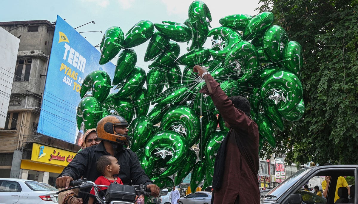 A vendor sells balloons at the Commercial Market in preparation for Independence Day on August 13, 2024. — APP