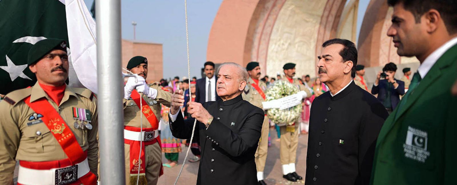 Prime Minister Shehbaz Sharif hoisting the national flag at an Independence Day event in Islamabad, the capital of the country as Olympian Arshad Nadeem and former prime minister Yusuf Raza Gilani observe on August 14, 2024 in Islamabad, Pakistan. — APP