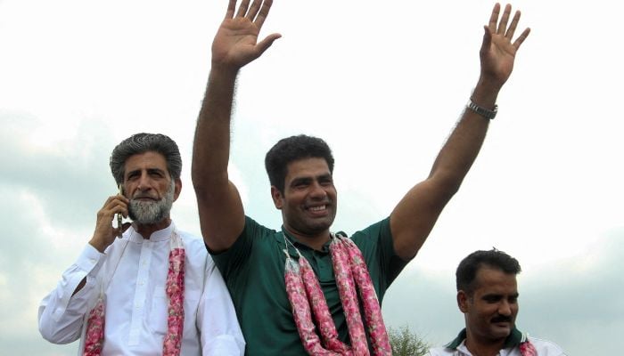 Arshad Nadeem pictured as he is swarmed with a warm welcome upon his return to his hometown after he won gold at the Paris Olympics 2024 in Mian Channu, Pakistan on August 11, 2024. — Reuters