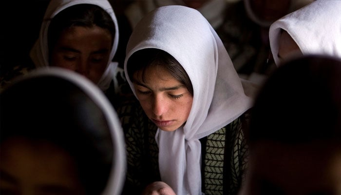 Afghan girls attend a class at the Ishkashim high school for girls in the northeastern province of Badakhshan, near the border with Tajikistan, Afghanistan April 23, 2008. — Reuters