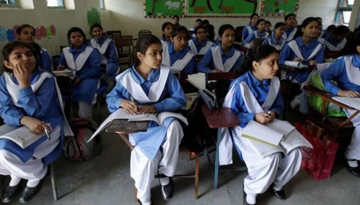 This undated photo shows students are listening to their teacher during a lesson at their school. —  Reuters/ file