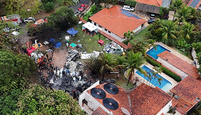 A drone view shows people working at the site of a plane crash in Vinhedo, Sao Paulo, Brazil, August 10, 2024. — Reuters