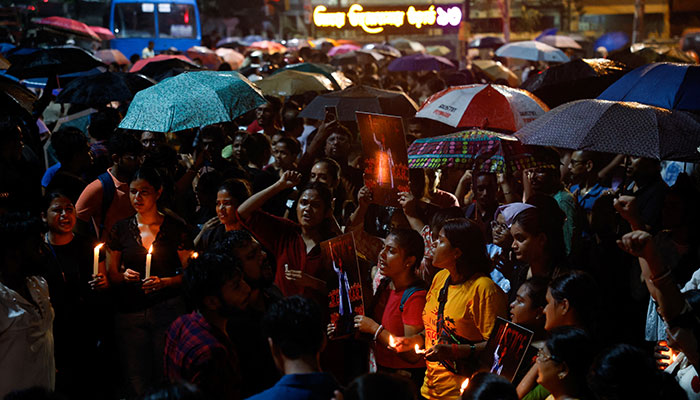 Women gather to take part in a candlelight vigil held outside the Jadavpur University campus, condemning the rape and murder of the female student doctor at a government-run hospital in Kolkata, August 15, 2024. — Reuters