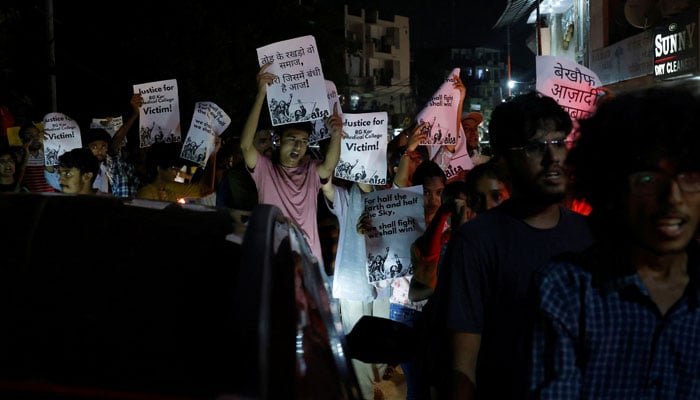 Students shout slogans as they hold placards during a protest rally demanding justice following the rape and murder of a trainee medic in Kolkata, in New Delhi, India, August 14, 2024. — Reuters