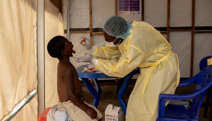 Representational image of a laboratory nurse taking a sample from a child declared a suspected case of Mpox at the the treatment centre in Munigi, Congo July 19, 2024. — Reuters