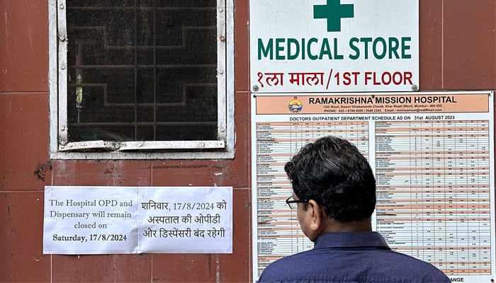 A man reads a notice at the entrance of a hospital in Mumbai, stating that the hospital OPD and dispensary are shut after a nationwide strike was declared by the Indian Medical Association to protest the rape and murder of a trainee medic at a government-run hospital in Kolkata, India, August 17, 2024. — Reuters