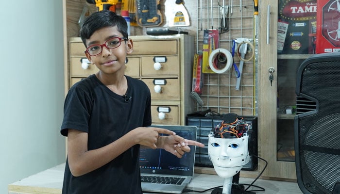 11-year-old Karachi boy Muhammad Hasnain demonstrates his AI-assistant robot. — Reporter