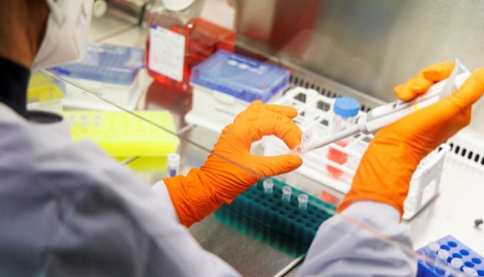 A laboratory worker of the vaccine company Bavarian Nordic pictured on May 24, 2022 in Martinsried near Munich, Germany. — Reuters