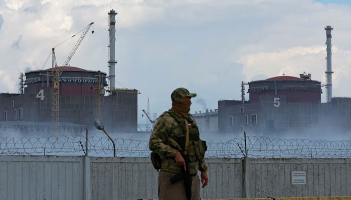 This  representational image shows a serviceman with a Russian flag on his uniform stands guard near the Zaporizhzhia Nuclear Power Plant in the course of Ukraine-Russia conflict outside the city of Enerhodar in the Zaporizhzhia region, Ukraine August 4, 2022. — Reuters