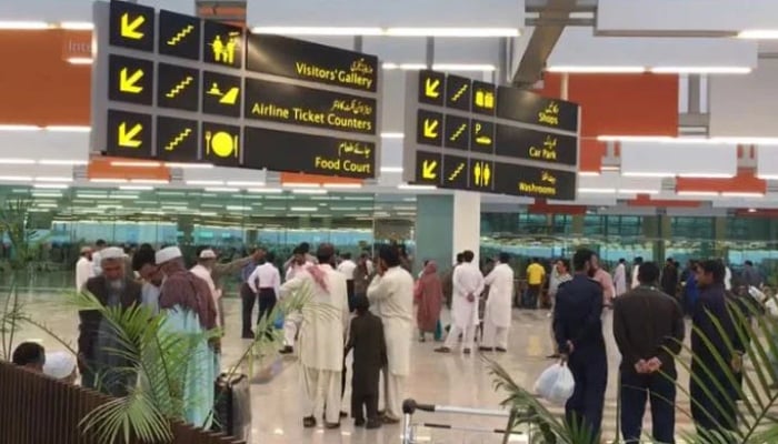 People are gathered at the Islamabad International Airport. — Geo News/ File