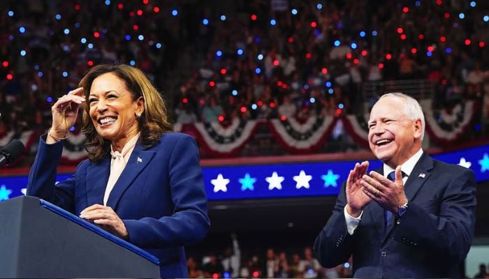 Vice President of the US and Democratic presidential nominee for US election 2024 Kamala Harris (L) and her running mate Tim Walz at a campaign event on august 7, 2024. — Reuters