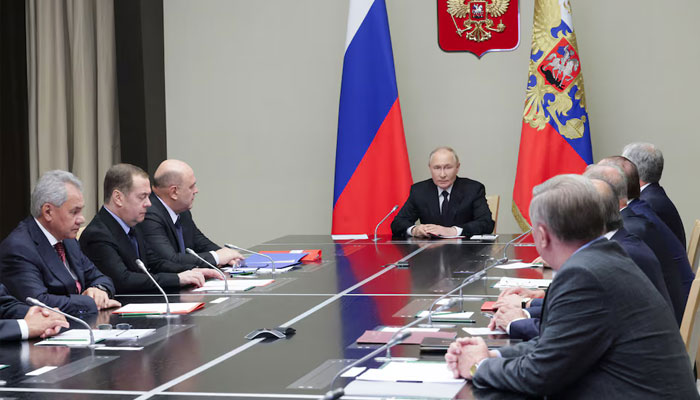 Russian President Vladimir Putin (center) seen in a meeting.— Reuters/file