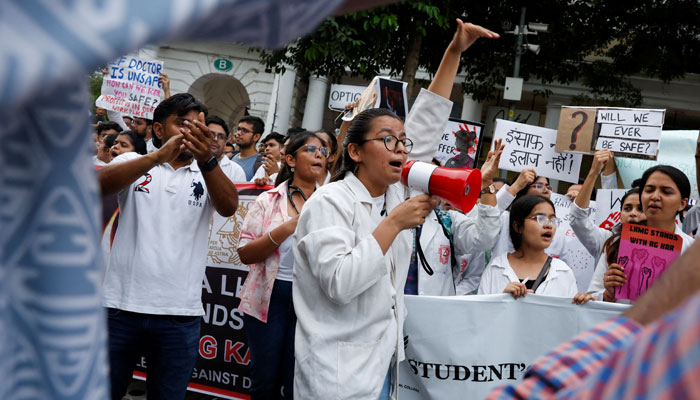 Doctors shout slogans as they hold placards during a protest rally demanding justice following the rape and murder of a trainee medic at a hospital in Kolkata, in New Delhi, India, August 18, 2024. — Reuters