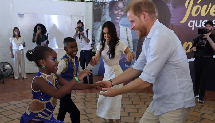 Meghan Markle, Prince Harry join student dancers on the floor