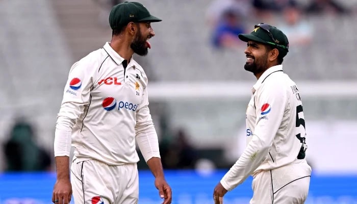 Pakistan captain Shan Masood (left) reacts with teammate Barbar Azam (right) after dropping a difficult catch on first day of second Test match against Australia at the Melbourne Cricket Ground (MCG) in Melbourne on December 26, 2023. —AFP