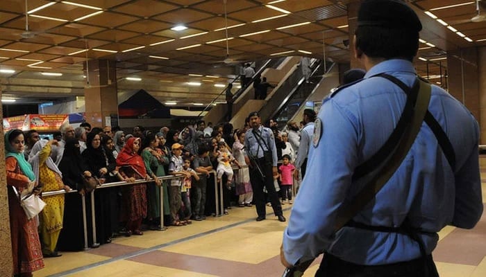 Airports Security Force (ASF) personnel standing guard at the Jinnah International Airport in Karachi. — AFP/File