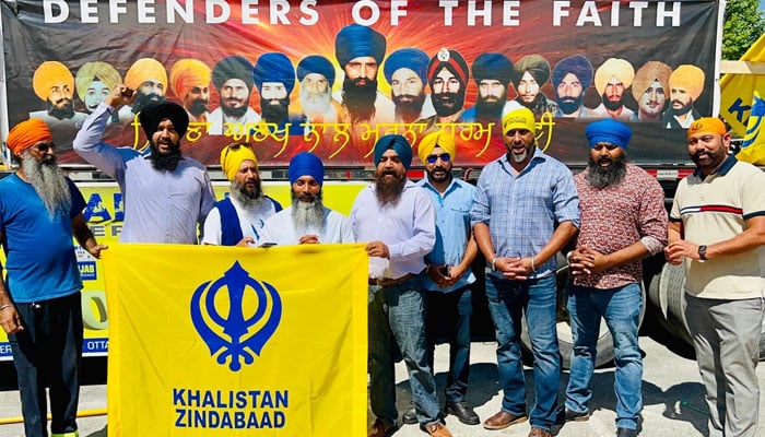 Killed Khalistan leader Hardeep Singh Nijjar stands with his associates. — Photo by author