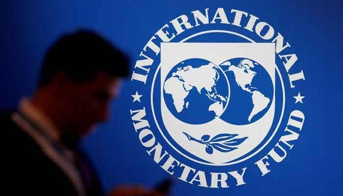 A participant stands near a logo of IMF at the International Monetary Fund - World Bank Annual Meeting 2018 in Nusa Dua, Bali, Indonesia, October 12, 2018. — Reuters