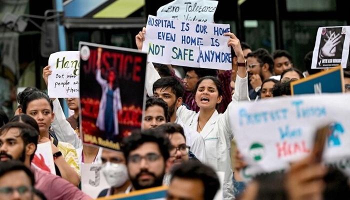 Medical professionals hold posters during a demonstration amid nationwide strike by doctors to condemn the rape and murder of a young medic from Kolkata, along a street in New Delhi on August 17, 2024. — AFP