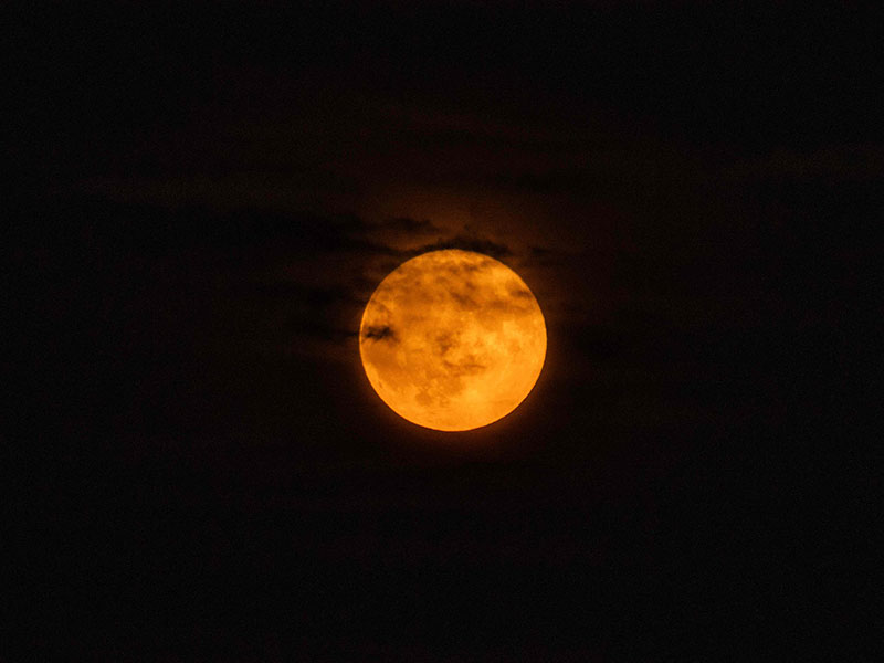 A blue supermoon rises above Boston Harbor in Boston, Massachusetts on August 19, 2024. — AFP