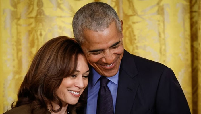 Former President Barack Obama hugs Vice President Kamala Harris during an event to mark the 2010 passage of the Affordable Care Act in the East Room of the White House on April 5, 2022 in Washington, DC. — AFP