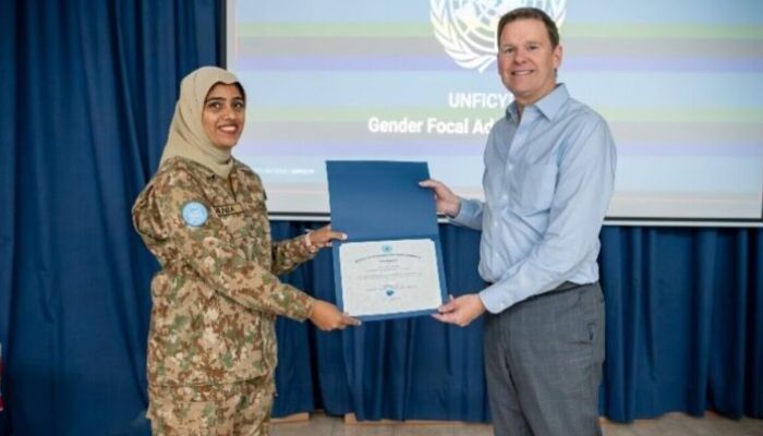 Major Sania Safdar posing with her Certificate of Recognition award (L) with Special Representative of the UN Secretary-General in Cyprus, Colin Stewart. — APP