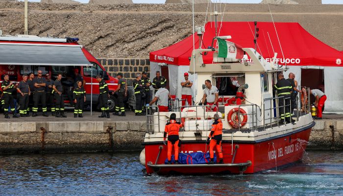 Rescue personnel transport a body bag after a luxury yacht, which was carrying British entrepreneur Mike Lynch, sank off the coast of Porticello, near the Sicilian city of Palermo, Italy on August 21, 2024. — Reuters