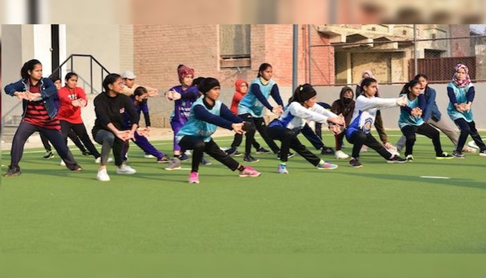 Warm up at the Government Girls Degree College, Jacobabad. Most girls feel awkward and shy when they first wear track pants and T-shirt but do realize they cannot run swiftly in their traditional outfits they are used to wearing. — IPS