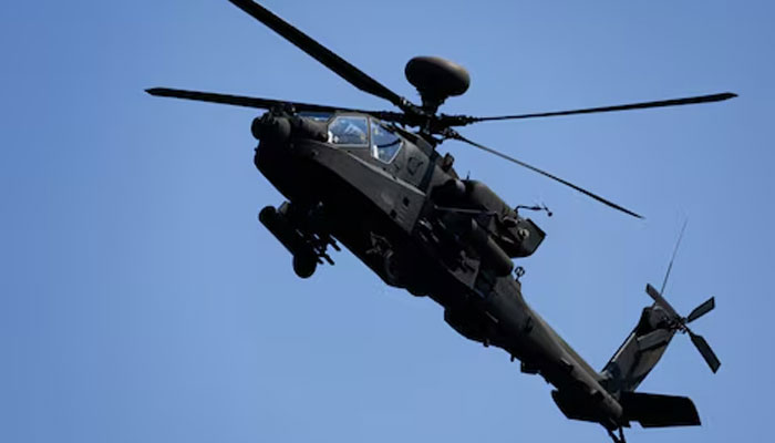 An AH-64 Apache helicopter flies during a live-fire drill of the US Armys 1st Armored Brigade Combat Team, 1st Armored Division at the Rodriguez Live Fire Complex, in Pocheon, South Korea, August 14, 2024. — Reuters