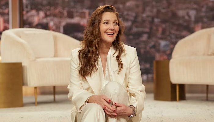 Drew Barrymore promises to control herself around guests