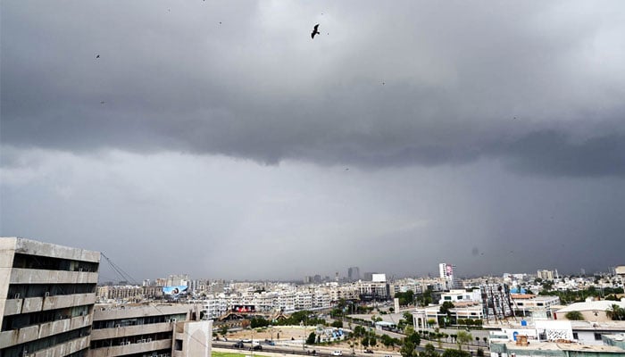 Nimbostratus clouds cover the sky in a dark gray layer over the metropolis, heralding the imminent arrival of rain in Karachi on July 19, 2024. — APP