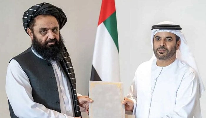 Ambassador of Afghanistan to UAE Mawlawi Badruddin Haqqani (left) hands over a copy of his credentials to Assistant Undersecretary for Protocol at the Ministry of Foreign Affairs, Saif Abdullah Al-Shamsi, during a ceremony on August 21, 2024. — X/@MoFA_Afg