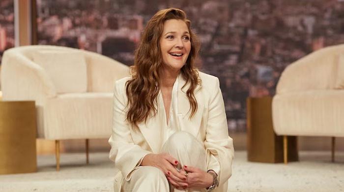 Drew Barrymore promises to control herself around guests