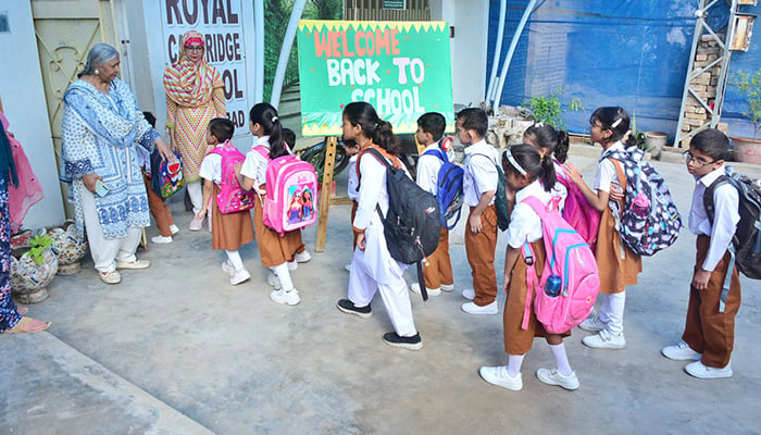 Students waiting outside their school in Hyderabad, on August 15, 2024. — APP