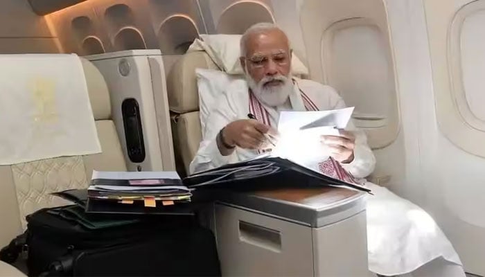 An undated image of Indian Prime Minister Narendra Modi sitting in an aircraft. — X/Indian Prime Ministers Office