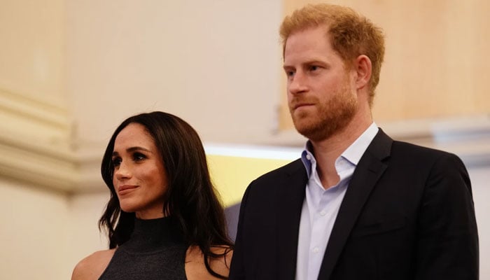 Meghan Markle reacts as Prince Harry yearns to reunite with Royal family