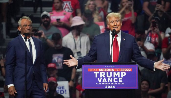 Former independent presidential candidate for US election 2024 Robert F Kennedy looks on (L) as former president and Republican presidential candidate speaks at a rally in Glendale, Arizona, US on August 23, 2024. — Reuters