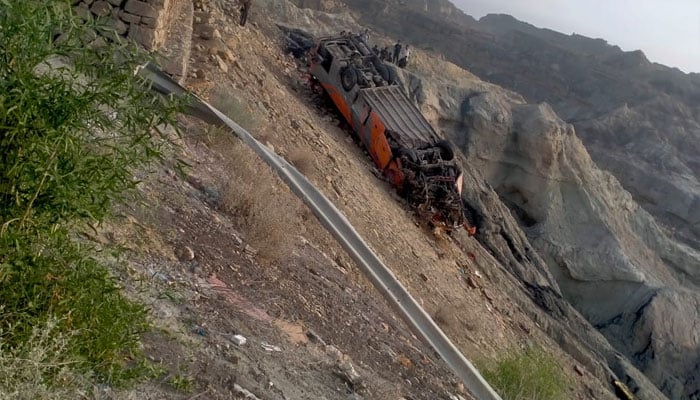 The ill-fated bus carrying pilgrims to Iran lies upside down after plunching into a ditch at the Makran Coastal Highway on August 25, 2024. — Reporter