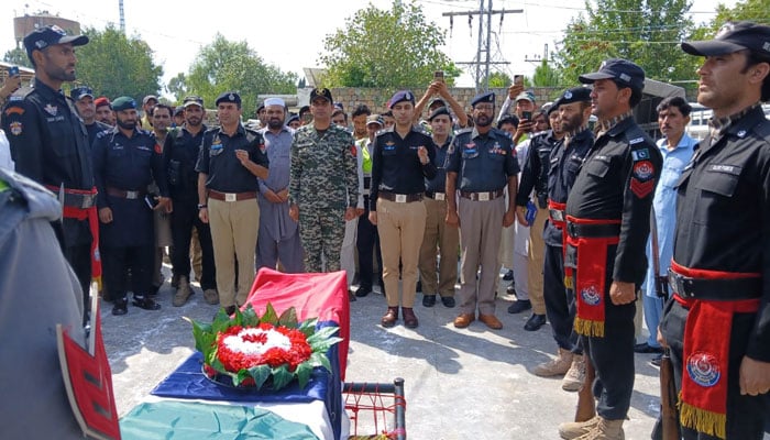 Police officials offer funeral prayer of policeman martyred in attack on checkpost on August 25, 2024. — Photo by reporter