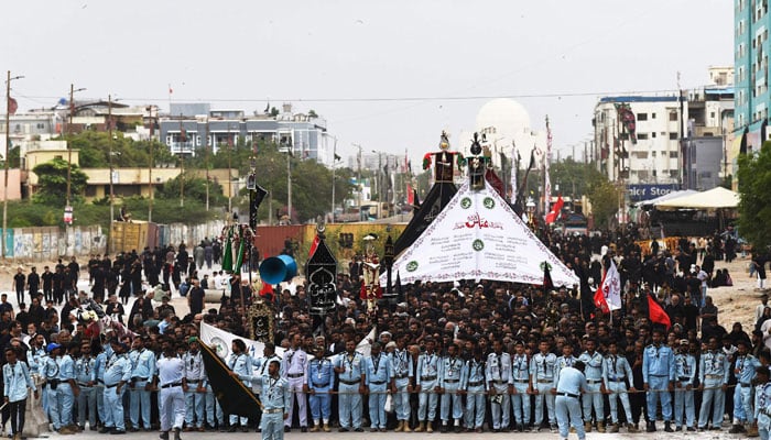 Muslims take part in a procession on the ninth day of Ashura in the Islamic month of Muharram in Karachi on July 28, 2023. — AFP